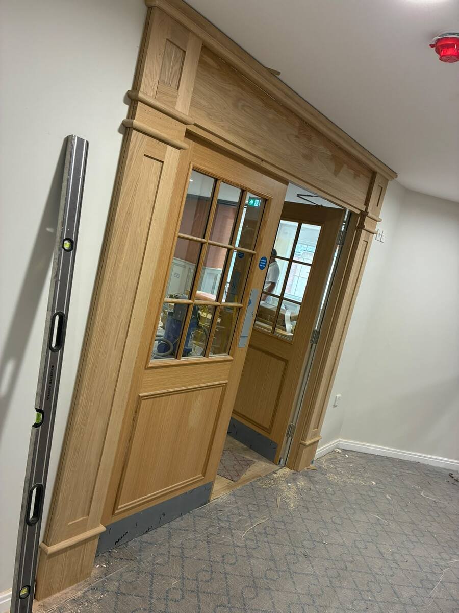 Bespoke oak door surround with glazed panels