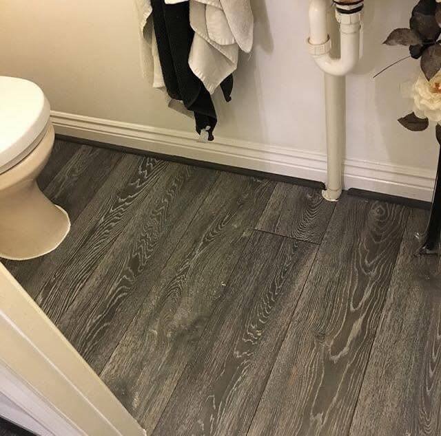 Luxury vinyl flooring installed in bathroom